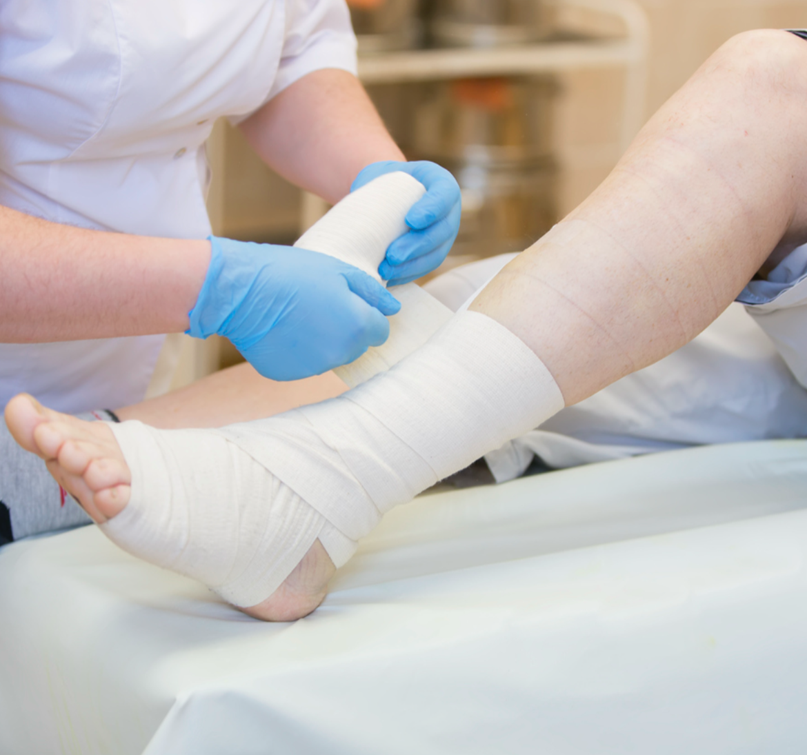 Wound care specialist treating a patient